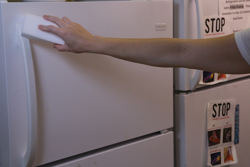 cleaning an office refrigerator with magic eraser
