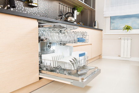 open dishwasher with dishes