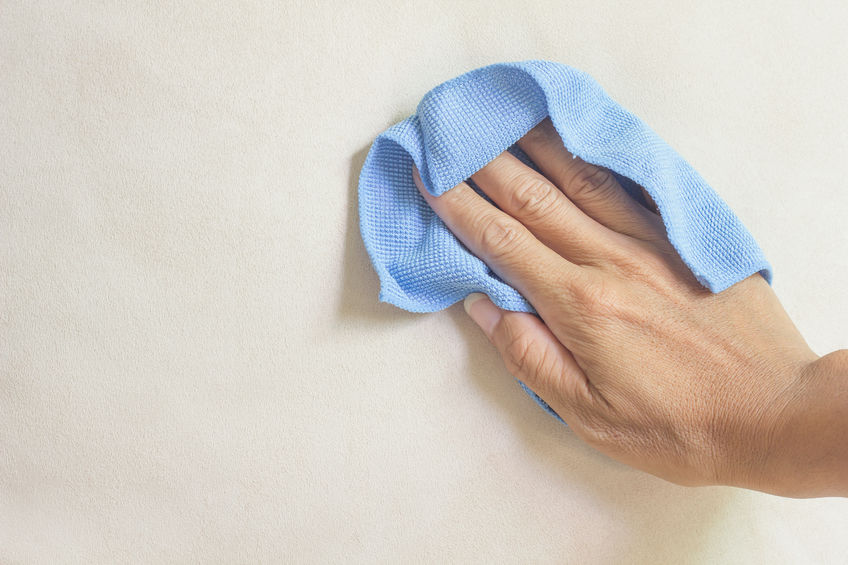 Dusting your home with a microfiber towel