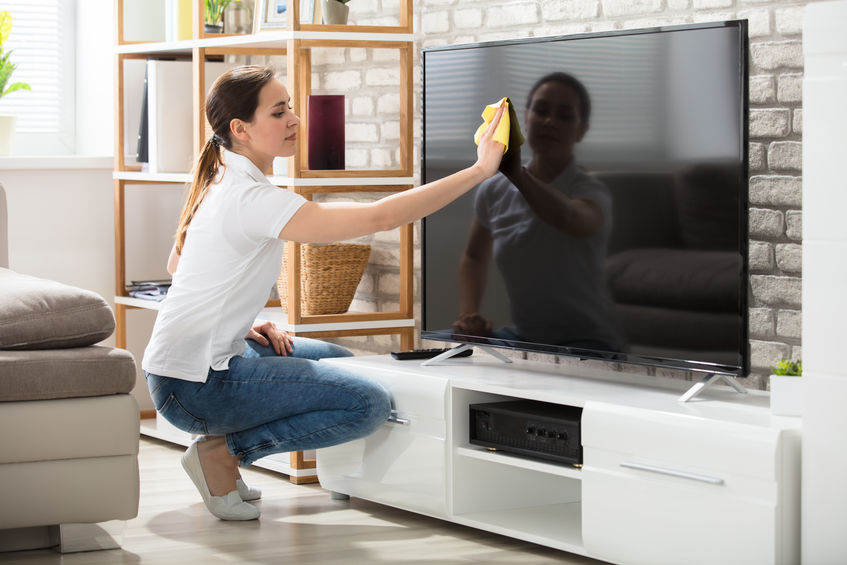 Woman using Sponge Outlet cleaning products