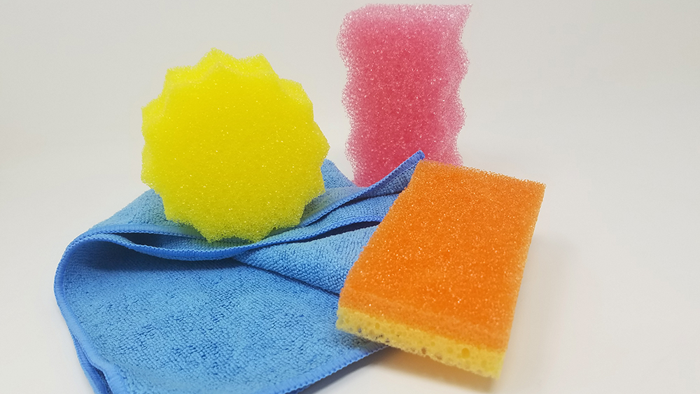 SpongeOutlet.com products recommended for cleaning a bike - a no-scratch scrub sponge to remove dirt and grease and a microfiber cleaning cloth to dry all parts. 