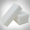 Three melamine foam eraser sponges in a pile. Spongec Outlet bulk eraser sponges