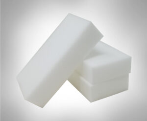 Three melamine foam eraser sponges in a pile. Spongec Outlet bulk eraser sponges