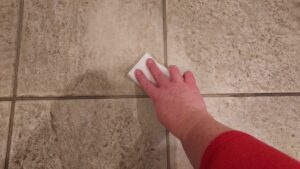 Cleaning Kitchen Tile with Sponge