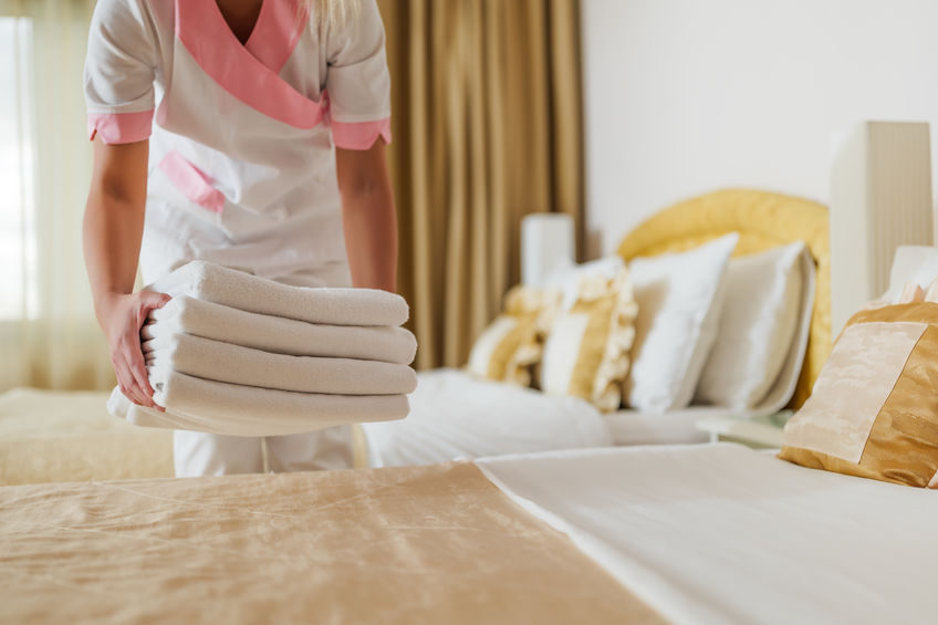 cleaning maid in hotel room